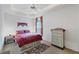 Bedroom with queen bed, dresser, and window at 6256 Pennell St, Englewood, FL 34224