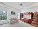 Bedroom with bunk beds, couch, and ample closet space at 6256 Pennell St, Englewood, FL 34224