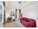 Bright bedroom with a desk, sofa, and ample natural light at 6256 Pennell St, Englewood, FL 34224