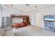 Spacious bedroom featuring a bunk bed and built-in shelving at 6256 Pennell St, Englewood, FL 34224
