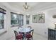 Breakfast nook with a round table and chairs, near a window at 6256 Pennell St, Englewood, FL 34224