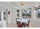 Breakfast nook with a round table and chairs, near a window at 6256 Pennell St, Englewood, FL 34224