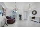 Bright and airy entryway with tile flooring and a seating area at 6256 Pennell St, Englewood, FL 34224