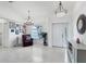 Bright and airy entryway with tile flooring and a seating area at 6256 Pennell St, Englewood, FL 34224
