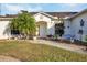 Landscaped entryway with a walkway leading to the front door at 6256 Pennell St, Englewood, FL 34224