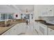 Eat-in kitchen featuring granite countertops and white cabinets at 6256 Pennell St, Englewood, FL 34224
