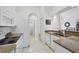 Bright kitchen with granite countertops and white cabinetry at 6256 Pennell St, Englewood, FL 34224
