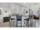 Kitchen with a breakfast bar and white cabinets at 6256 Pennell St, Englewood, FL 34224