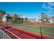 Tennis and pickleball courts with surrounding fencing at 6800 Placida Rd # 165, Englewood, FL 34224