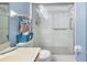Clean bathroom with a walk-in shower and grab bars at 6800 Placida Rd # 165, Englewood, FL 34224