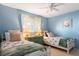 Light and airy bedroom with twin beds, dresser, and coastal decor at 6800 Placida Rd # 165, Englewood, FL 34224