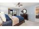 Bedroom with double bed, dark wood furniture, and patio access at 6800 Placida Rd # 165, Englewood, FL 34224