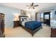 Bedroom with double bed, dark wood furniture, and sliding door to patio at 6800 Placida Rd # 165, Englewood, FL 34224