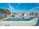 Inviting community pool with ample deck space at 6800 Placida Rd # 165, Englewood, FL 34224
