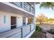 Exterior view of condo building showcasing a welcoming entrance and waterfront views at 6800 Placida Rd # 165, Englewood, FL 34224