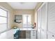 Home office with white desk and built-in shelving at 6800 Placida Rd # 165, Englewood, FL 34224