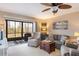 Relaxing living room with comfortable seating and access to a screened lanai at 6800 Placida Rd # 165, Englewood, FL 34224