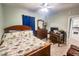 Bedroom with a full-size bed and a small workspace, opens to the kitchen at 8050 Memory Ln # 104, Rotonda West, FL 33947