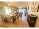 Open concept dining room with wooden table and chairs near living room at 8050 Memory Ln # 104, Rotonda West, FL 33947