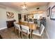 Light and airy dining room with a large wooden table and bar-style seating at 8050 Memory Ln # 104, Rotonda West, FL 33947