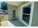 Condo entrance with wreath and window at 8050 Memory Ln # 104, Rotonda West, FL 33947