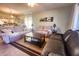 Living room with comfortable seating and large window providing natural light at 8050 Memory Ln # 104, Rotonda West, FL 33947