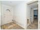 Entryway with damaged walls and flooring at 860 Knights Ln, Englewood, FL 34223