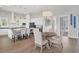 Kitchen island with seating and a nearby dining table at 9000 Falcon Ct, Venice, FL 34293