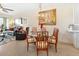 Bright dining area featuring a glass-top table and four chairs at 9203 Griggs Rd # B302, Englewood, FL 34224