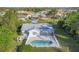 Aerial view of a single-story home with a pool and fenced backyard at 9261 Saint Catherine Ave, Englewood, FL 34224