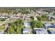 Aerial view of residential neighborhood showcasing numerous homes and lush green landscape at 9261 Saint Catherine Ave, Englewood, FL 34224