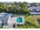 Aerial view showcasing a home's pool and backyard at 9261 Saint Catherine Ave, Englewood, FL 34224