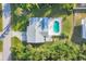 Bird's-eye view of a house with a pool and yard at 9261 Saint Catherine Ave, Englewood, FL 34224