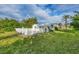 Spacious backyard with a pool and white fence at 9261 Saint Catherine Ave, Englewood, FL 34224