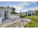 Backyard oasis with a pool, patio, and white arbor at 9261 Saint Catherine Ave, Englewood, FL 34224