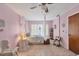Bedroom with canopy bed and light pink walls at 9261 Saint Catherine Ave, Englewood, FL 34224