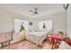 Bedroom with twin bed and adjacent sitting area at 9261 Saint Catherine Ave, Englewood, FL 34224
