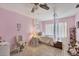 Bedroom with canopy bed and light pink walls at 9261 Saint Catherine Ave, Englewood, FL 34224