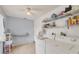 Laundry room with washer, dryer and shelving at 9261 Saint Catherine Ave, Englewood, FL 34224