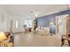 Bright living room with tiled floors and access to other rooms at 9261 Saint Catherine Ave, Englewood, FL 34224