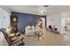Cozy living room featuring a comfortable couch and a grandfather clock at 9261 Saint Catherine Ave, Englewood, FL 34224