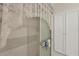 Shower with white tile and lace curtain at 9261 Saint Catherine Ave, Englewood, FL 34224
