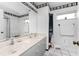 Bathroom with double vanity and a large mirror at 9822 Gulfstream Blvd, Englewood, FL 34224
