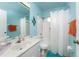 Clean bathroom with light blue walls and a shower/tub combo at 9822 Gulfstream Blvd, Englewood, FL 34224