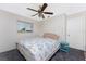 Comfortable bedroom with ceiling fan and carpeting at 9822 Gulfstream Blvd, Englewood, FL 34224