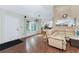 Bright entryway with hardwood floors and a view into the living room at 9822 Gulfstream Blvd, Englewood, FL 34224