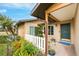 Inviting front entrance with a charming white picket fence at 9822 Gulfstream Blvd, Englewood, FL 34224