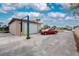 Detached garage with car lift and ample storage at 9822 Gulfstream Blvd, Englewood, FL 34224