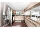 Modern kitchen with stainless steel appliances and wood flooring at 9822 Gulfstream Blvd, Englewood, FL 34224