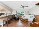 Open kitchen with a breakfast bar and wood-look floors at 9822 Gulfstream Blvd, Englewood, FL 34224